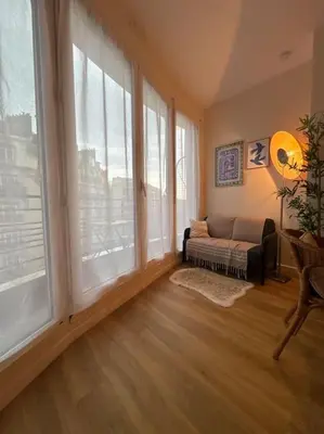 Un ou plusieurs lits dans un hébergement de l'établissement Suite Paris Tour Eiffel