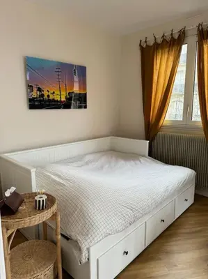 Un ou plusieurs lits dans un hébergement de l'établissement Suite Paris Tour Eiffel