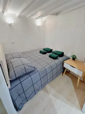 Un ou plusieurs lits dans un hébergement de l'établissement Appartement au centre de Paris
