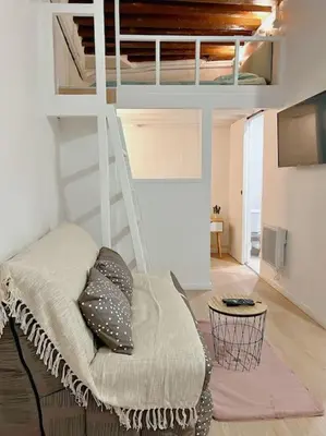 Un ou plusieurs lits dans un hébergement de l'établissement Appartement au centre de Paris