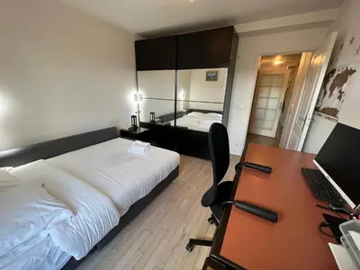 Un ou plusieurs lits dans un hébergement de l'établissement Duplex Terrasse au soleil