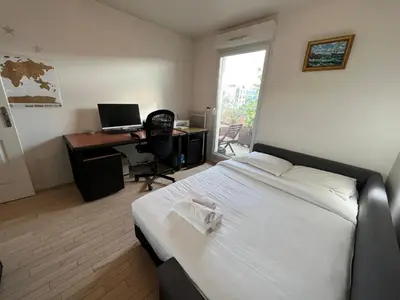Un ou plusieurs lits dans un hébergement de l'établissement Duplex Terrasse au soleil
