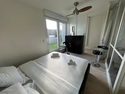 Un ou plusieurs lits dans un hébergement de l'établissement Duplex Terrasse au soleil