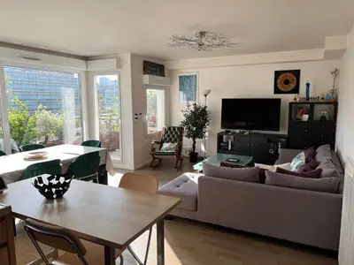 Télévision ou salle de divertissement dans l'établissement Duplex Terrasse au soleil