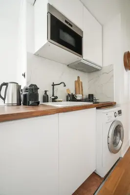 Cuisine ou kitchenette dans l'établissement Luxe appartement Parisien
