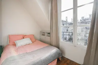 Un ou plusieurs lits dans un hébergement de l'établissement Luxe appartement Parisien