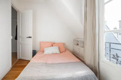 Un ou plusieurs lits dans un hébergement de l'établissement Luxe appartement Parisien