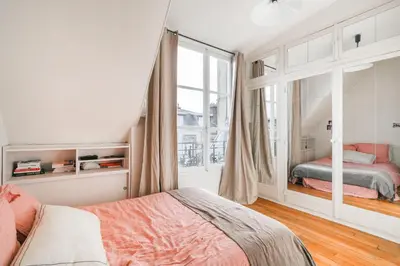 Un ou plusieurs lits dans un hébergement de l'établissement Luxe appartement Parisien