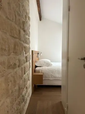 Un ou plusieurs lits dans un hébergement de l'établissement Elegant loft-duplex pour 2/3 personnes