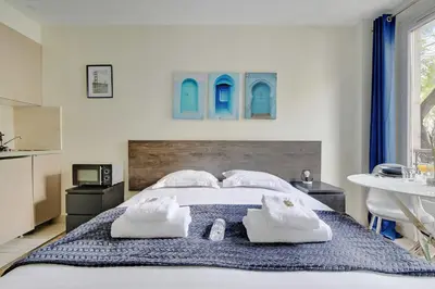 Un ou plusieurs lits dans un hébergement de l'établissement Comfort studio at Gare de l Est