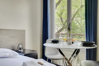 Un ou plusieurs lits dans un hébergement de l'établissement Comfort studio at Gare de l Est