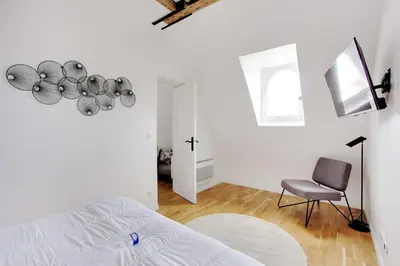 Un ou plusieurs lits dans un hébergement de l'établissement Charming apartment - 1BR-3P -Trocadero