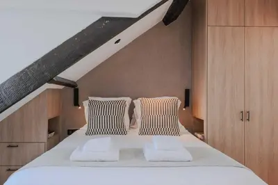 Un ou plusieurs lits dans un hébergement de l'établissement Charming and intimate apartment - 2BR-3P - Louvre