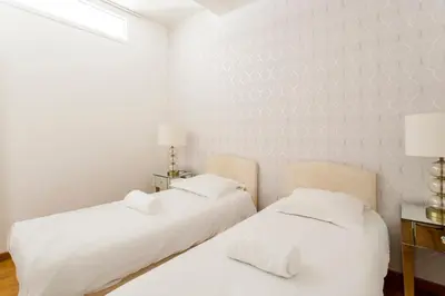 Un ou plusieurs lits dans un hébergement de l'établissement Champs-Élysées Lincoln - 2BDR