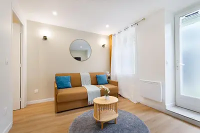 Coin salon dans l'établissement Appartement 2 pièces Boulogne Roland Garros