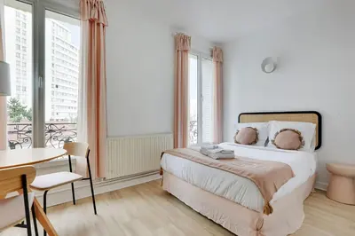 Un ou plusieurs lits dans un hébergement de l'établissement MALAKOFF - Cosy Suite L030
