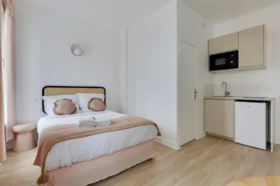 Un ou plusieurs lits dans un hébergement de l'établissement MALAKOFF - Cosy Suite L030