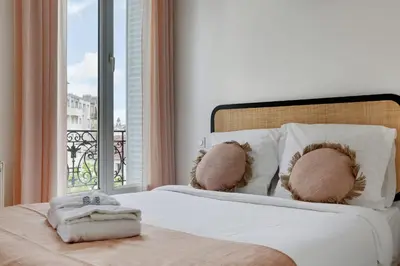 Un ou plusieurs lits dans un hébergement de l'établissement MALAKOFF - Cosy Suite L030