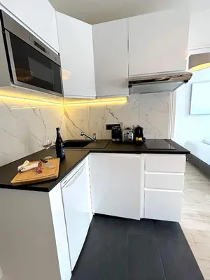 Cuisine ou kitchenette dans l'établissement L'appartement Bouquet