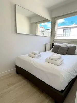Un ou plusieurs lits dans un hébergement de l'établissement L'appartement Bouquet
