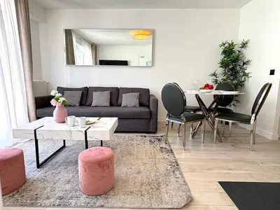 Coin salon dans l'établissement L'appartement Bouquet