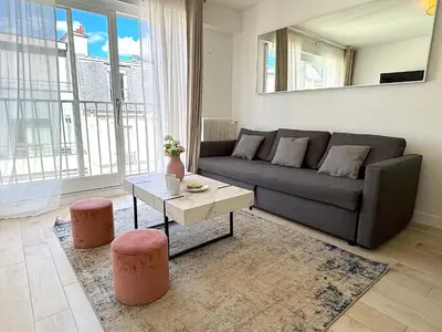 Coin salon dans l'établissement L'appartement Bouquet