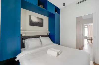 Un ou plusieurs lits dans un hébergement de l'établissement Magnifique Appartement Paris XVIIe-Tout équipé!