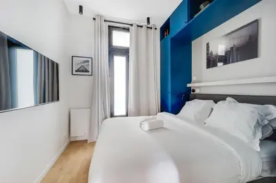 Un ou plusieurs lits dans un hébergement de l'établissement Magnifique Appartement Paris XVIIe-Tout équipé!