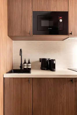 Cuisine ou kitchenette dans l'établissement Magnificent Studio with A-C - 2P - Champs-Élysées