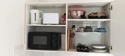 Cuisine ou kitchenette dans l'établissement Cosy Studio La Defense