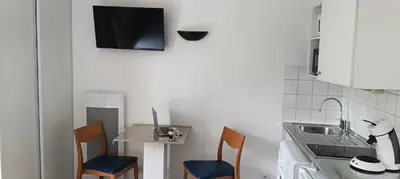 Cuisine ou kitchenette dans l'établissement Cosy Studio La Defense