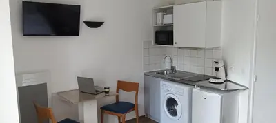 Cuisine ou kitchenette dans l'établissement Cosy Studio La Defense