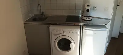 Cuisine ou kitchenette dans l'établissement Cosy Studio La Defense