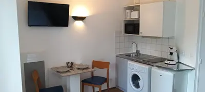 Cuisine ou kitchenette dans l'établissement Cosy Studio La Defense