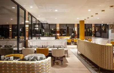 Coin salon dans l'établissement Hôtel Kyriad Prestige Paris Asnieres