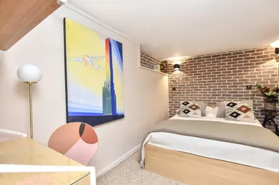 Un ou plusieurs lits dans un hébergement de l'établissement Magnificent apartment- 2BR-6P - Republique