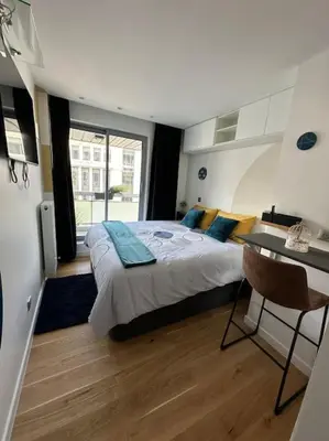 Un ou plusieurs lits dans un hébergement de l'établissement JOIA PARIS - Vaugirard