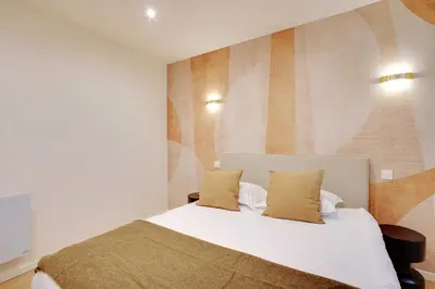 Un ou plusieurs lits dans un hébergement de l'établissement Elegant Apartment - 1BR-2P - Arc de Triomphe