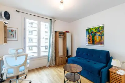 Coin salon dans l'établissement GuestReady - Cozy Retreat near Place de la Nation