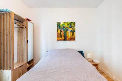 Un ou plusieurs lits dans un hébergement de l'établissement GuestReady - Cozy Retreat near Place de la Nation