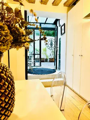 Un ou plusieurs lits dans un hébergement de l'établissement Splendid atypical loft st germain