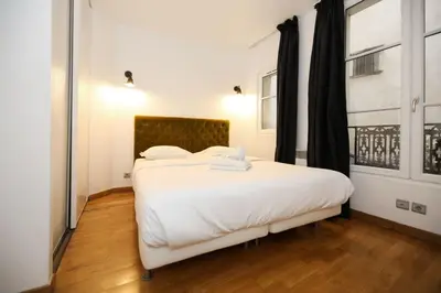 Un ou plusieurs lits dans un hébergement de l'établissement 106- Appartement lumineux face jardins des Plantes - FLAT-GUEST