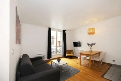 Télévision ou salle de divertissement dans l'établissement 106- Appartement lumineux face jardins des Plantes - FLAT-GUEST