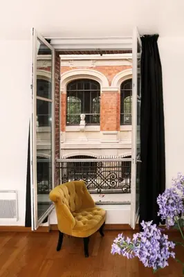 Coin salon dans l'établissement 106- Appartement lumineux face jardins des Plantes - FLAT-GUEST