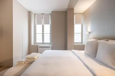 Un ou plusieurs lits dans un hébergement de l'établissement Cosy and Charming flat - 15ème - convention