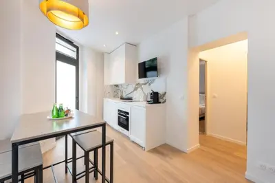 Cuisine ou kitchenette dans l'établissement Cosy and Charming flat - 15ème - convention