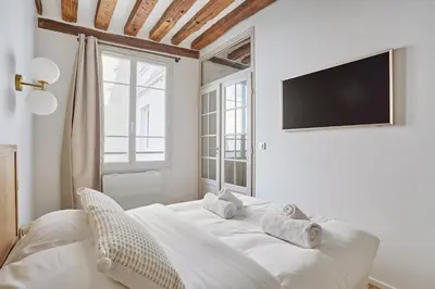 Un ou plusieurs lits dans un hébergement de l'établissement Eiffel Tower Apartment/Invalide by Studioprestige
