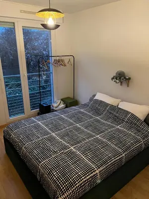Un ou plusieurs lits dans un hébergement de l'établissement Appartement Paisible au Vert