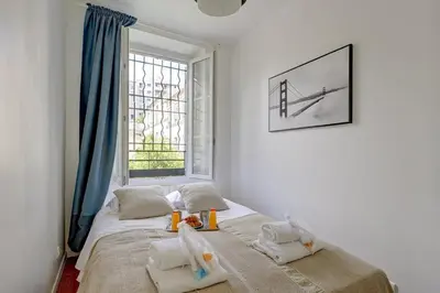Un ou plusieurs lits dans un hébergement de l'établissement 387 Suite Sourire - Superbe Appartement à Paris