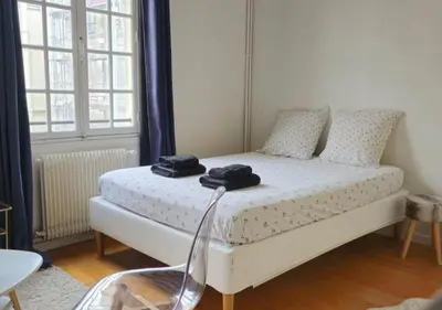 Un ou plusieurs lits dans un hébergement de l'établissement Chez Maëlle - Tour Eiffel Cosy Flat